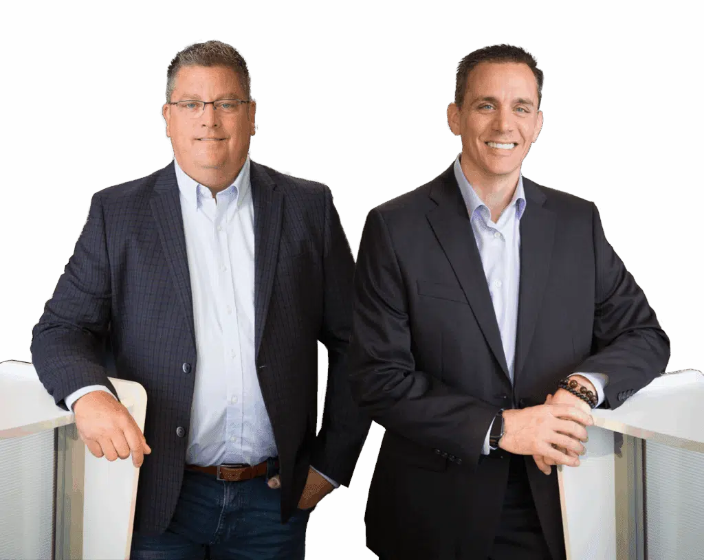 Co-founders Jason Martin and Bill Coy of Product Fulfillment Solutions, standing confidently in business attire, representing dedication to quality and efficient fulfillment services.